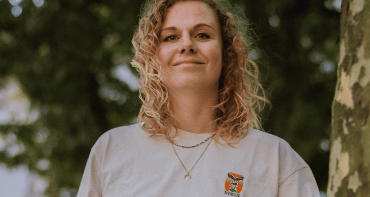 Illustrator Janina wears her specially designed NIKIN shirt.
