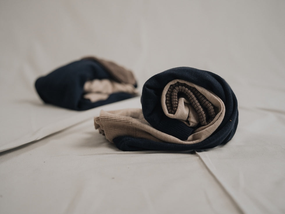 Produits en laine NIKIN roulés ensemble.