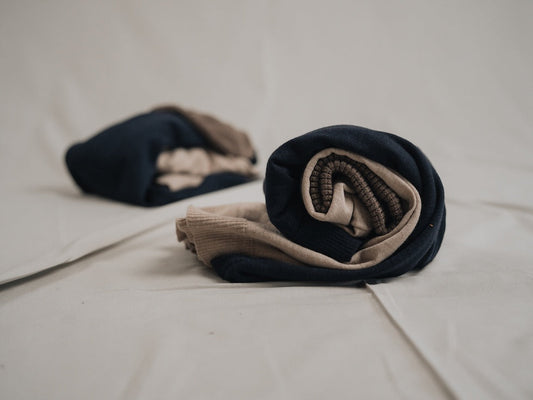 Produits en laine NIKIN roulés ensemble.